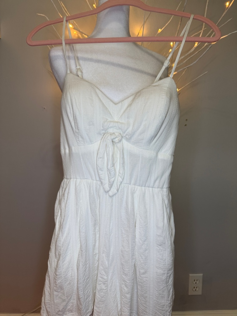 Romper gauze, like material,  adjustable straps and line at bottom legs